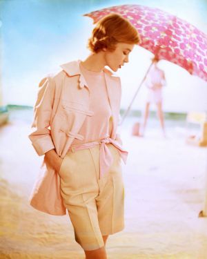 pink top and jacket pink umbrella beige shorts on beach - Tom-Palumbo.jpg